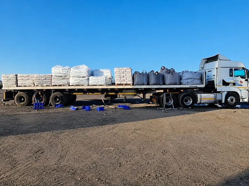SteelBand Projects flatdeck trailer loaded with bagged and bulk goods
